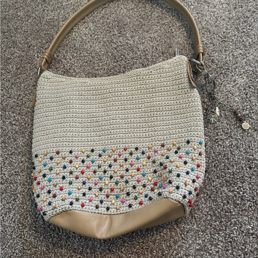 The Sak Cream Hobo Bag with Playful Design
